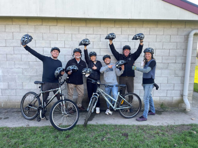 Partnership putting helmets on heads